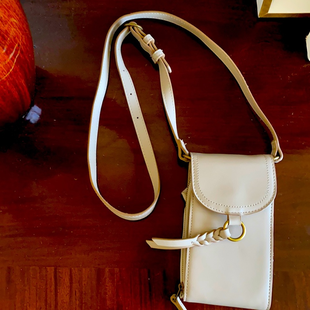 Gray crossbody wallet. Never used. Tassel closure.